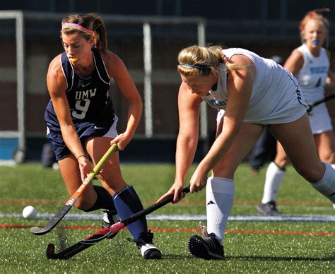 field hockey. The modern game of field hockey, whether for men or women, is played by two 11-member teams using sticks with a crook at the striking end. The object is to hit a ball into the opponent’s goal. The playing field is 100 yards long and 60 yards wide, and the most common playing surface is grass. However, all international matches ...